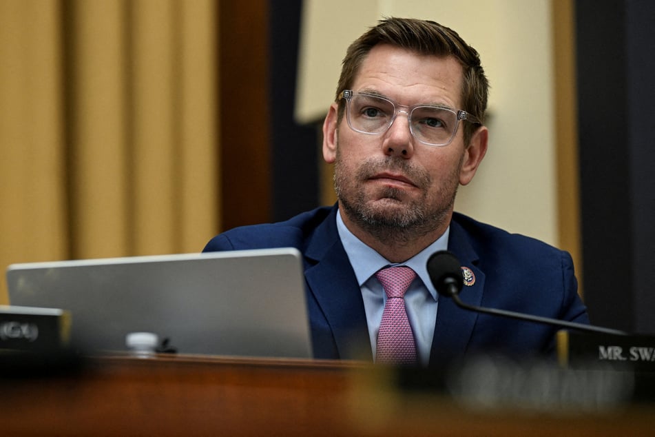 Dozens of staffers have demanded Representative Eric Swalwell resign from Congress.