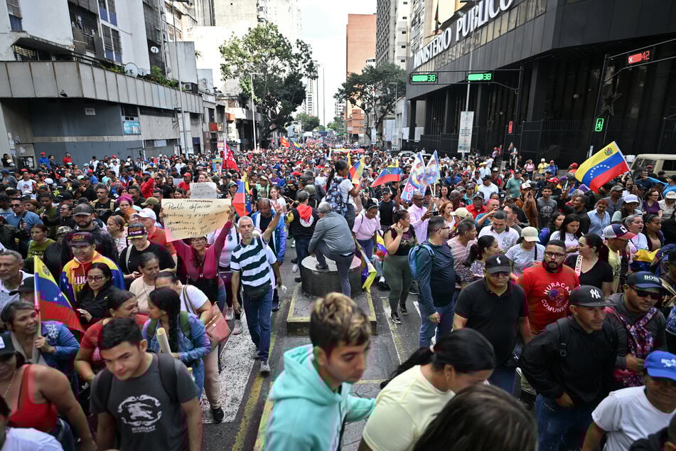 Supporters of Venezuela's ousted President Nicolas Maduro demonstrate in Caracas on Sunday, a day after he was captured in a US strike.