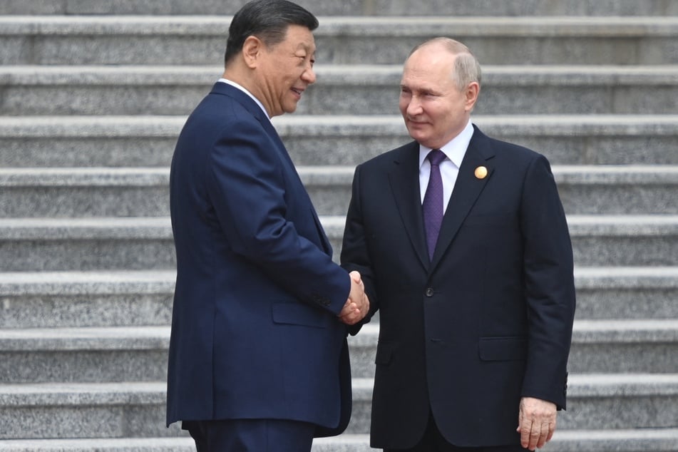 Chinese President Xi Jinping (l.) and Russian President Vladimir Putin (r.) framed their nations' ties as a stabilizing force as they met Thursday in Beijing, where the Russian president is seeking greater Chinese backing for his war effort.