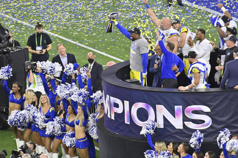 Los Angeles Rams players, coaches, and staff celebrate after defeating the Cincinnati Bengals 23-20 in Super Bowl LVI.
