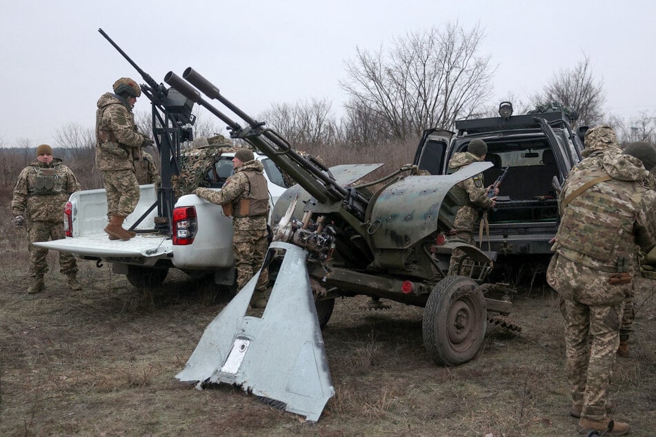 Air Defence Ukrainian servicemen, who took part in the defense operations during recent attacks on Kyiv, prepare their weapons near Kyiv on January 3, 2024, amid the Russian invasion of Ukraine.