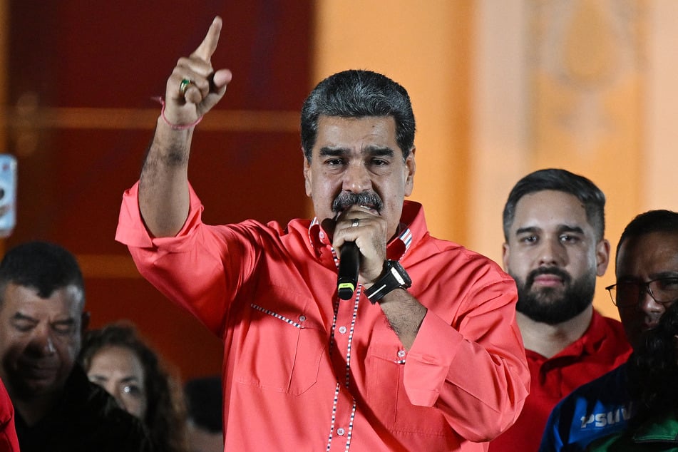 Venezuelan President Nicolas Maduro speaks to supporters as he celebrates the results of the parliamentary and regional elections at the Bolivar square in Caracas on May 25, 2025.