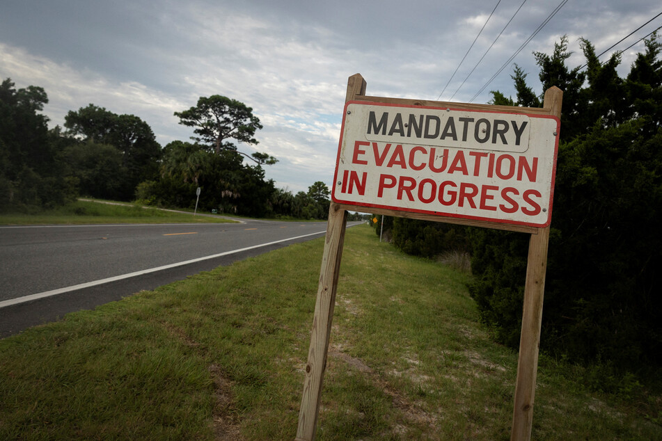 A mandatory evacuation sign is seen ahead of the arrival of Hurricane Idalia, in Cedar Key, Florida, on August 29, 2023.
