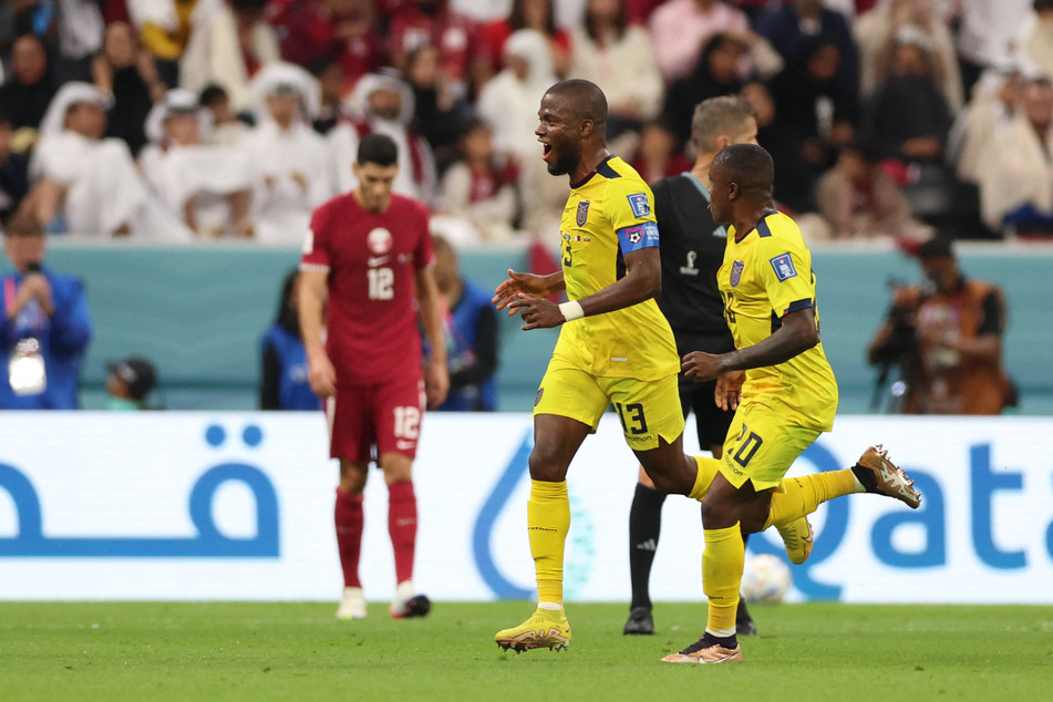 Ecuador striker Enner Valencia (c.) celebrates his second goal against Qatar.
