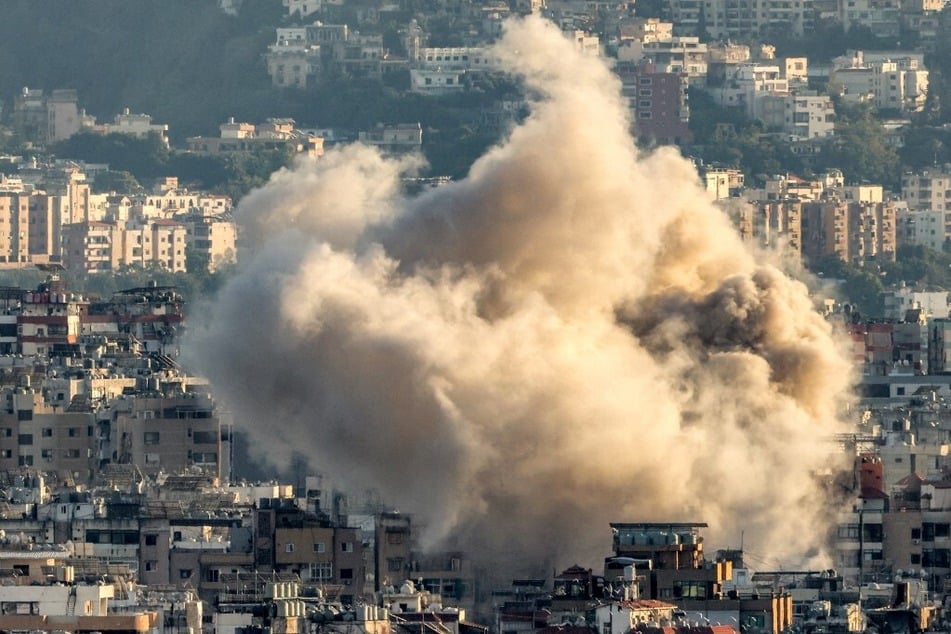 A cloud of smoke erupts following an Israeli airstrike on Beirut's southern suburbs on October 19, 2024.