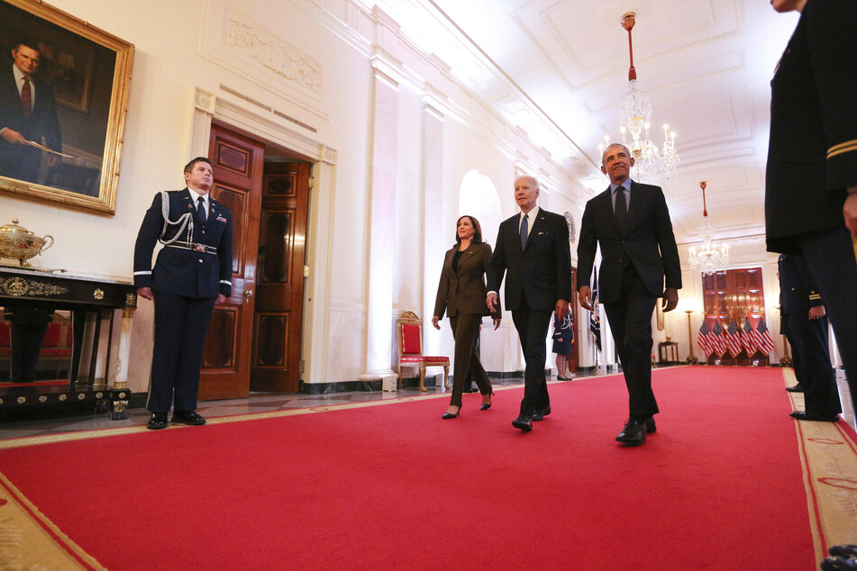 Vice President Kamala Harris, President Joe Biden, and former President Barack Obama arrive to deliver remarks on the Affordable Care Act.