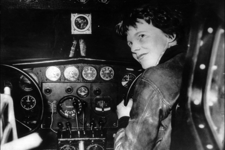 Undated picture taken in the 1930s of American female aviator Amelia Earhart at the controls of her plane.