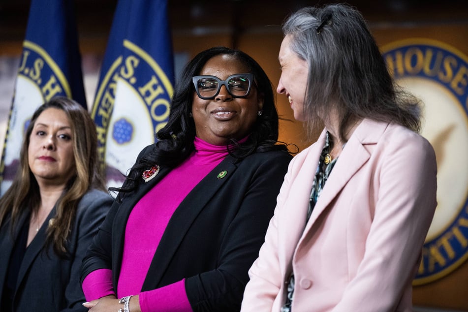 Democratic Congresswoman LaMonica McIver (c.) has been charged with assault and impeding law enforcement after a clash outside an ICE detention center.