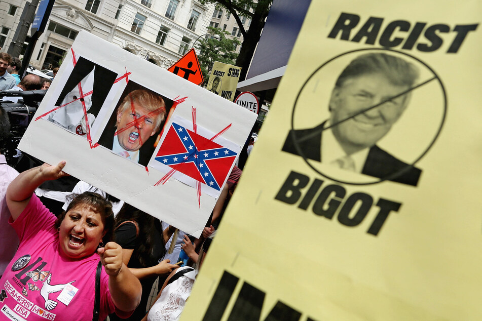 Activists protesting the candidacy of Donald Trump outside the Trump International Hotel in Washington DC on July 9, 2015.