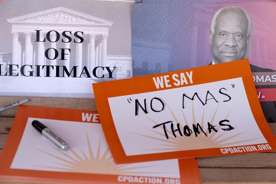 Signs calling on US Supreme Court Justice Clarence Thomas to resign are seen on Capitol Hill in Washington DC.