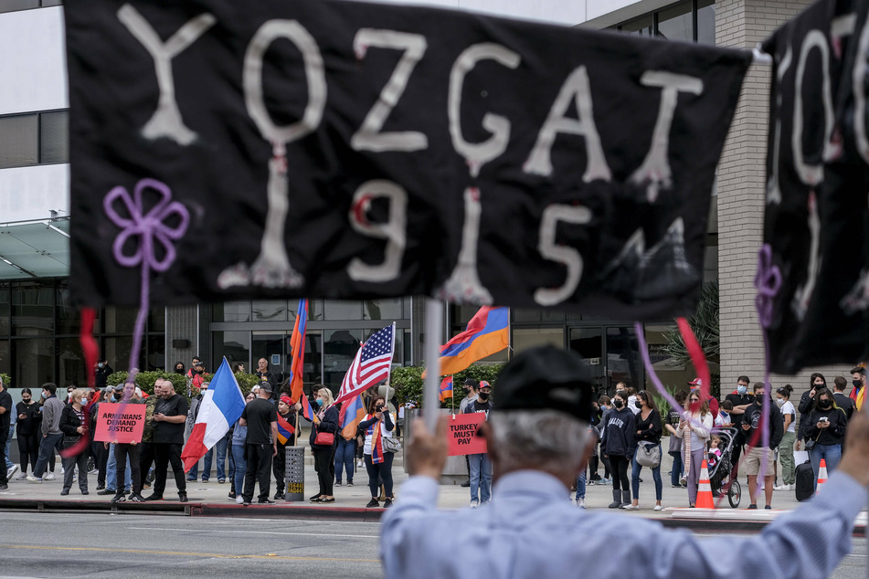 Armenians and their supporters carried signs during a rally to commemorate the 106th anniversary of the Armenian Genocide, in front of the Turkish Consulate in LA.