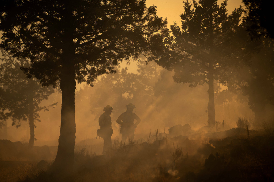 Firefighters look for hotspots in the area around Mount Shasta, California.