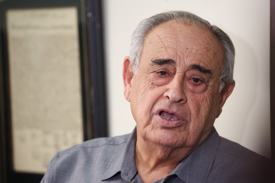 Car wash owner Rafie Ollah Shouhed speaks at a press conference in Los Angeles, California, on September 25, 2025.
