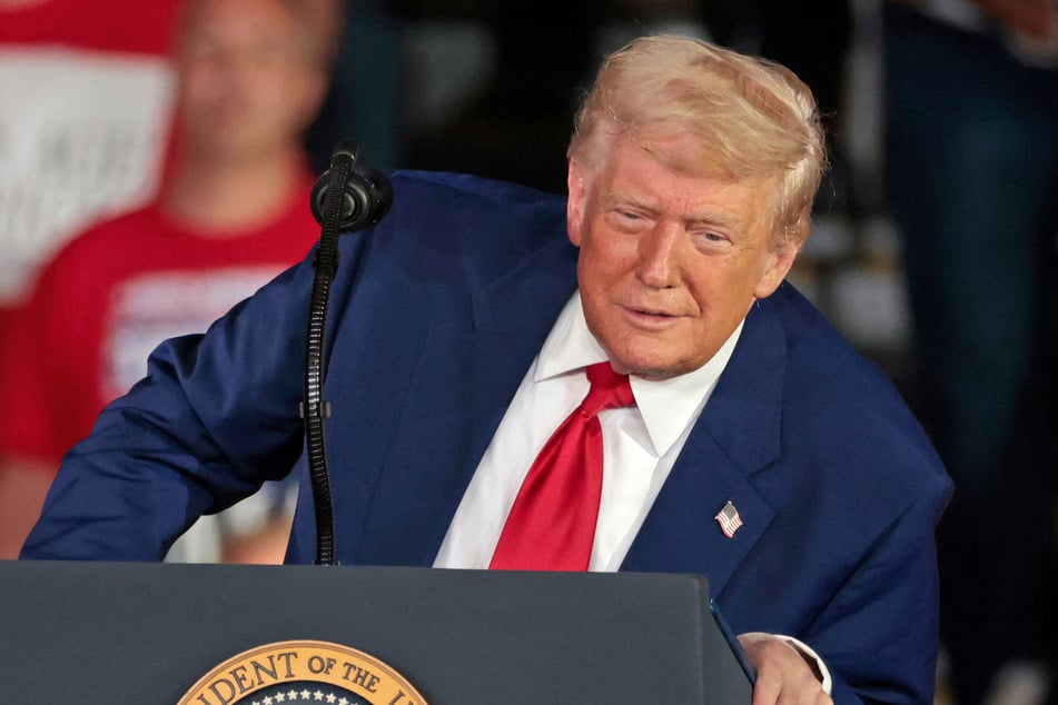 President Donald Trump lashed out at his predecessor's economic record Wednesday after US financial markets fell on the news that the American economy unexpectedly contracted in the first three months of the year.