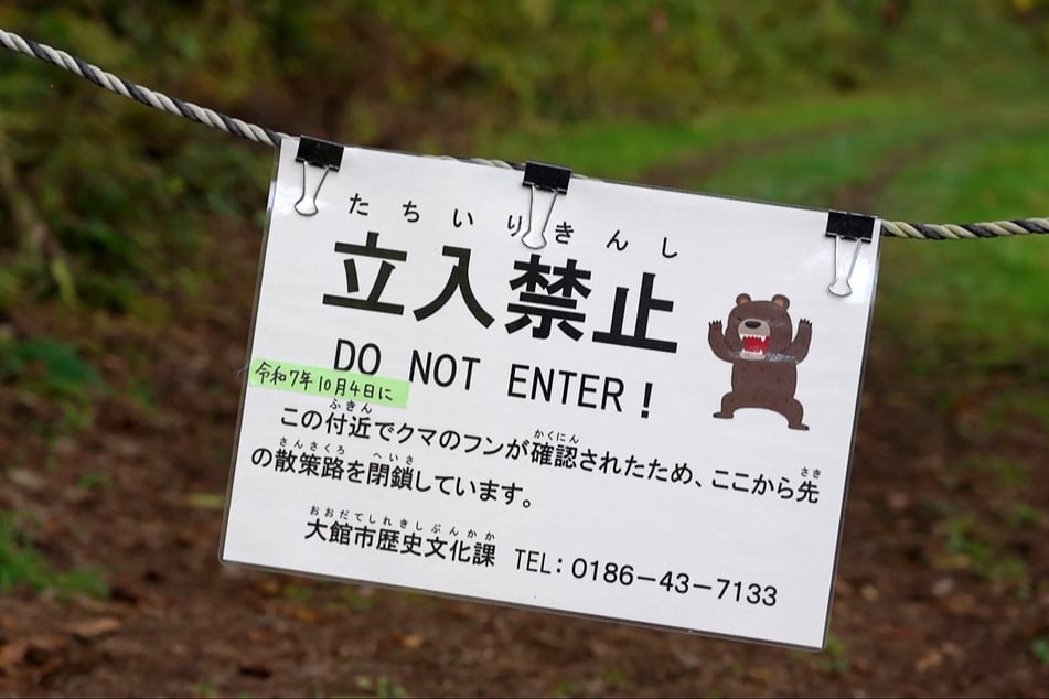 Bear sightings have significantly increased in Japan in recent years. This is a sign from 2025, warning hikers of bear activity in a forested area in Akita Prefecture.