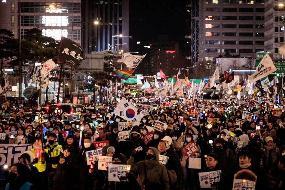 Thousands of South Koreans gathered for demonstrations in the capital on Saturday, as investigators prepare another attempt to arrest the suspended president.