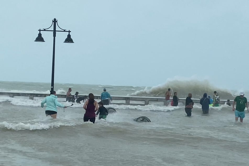 People gather at Key West pier as Hurricane Ian approaches.