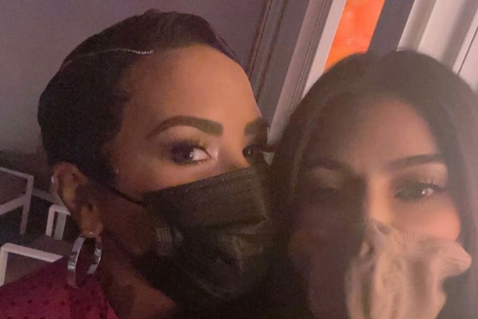 Demi Lovato and Kim Kardashian grabbed a quick selfie during Demi's premiere – of course, wearing masks.