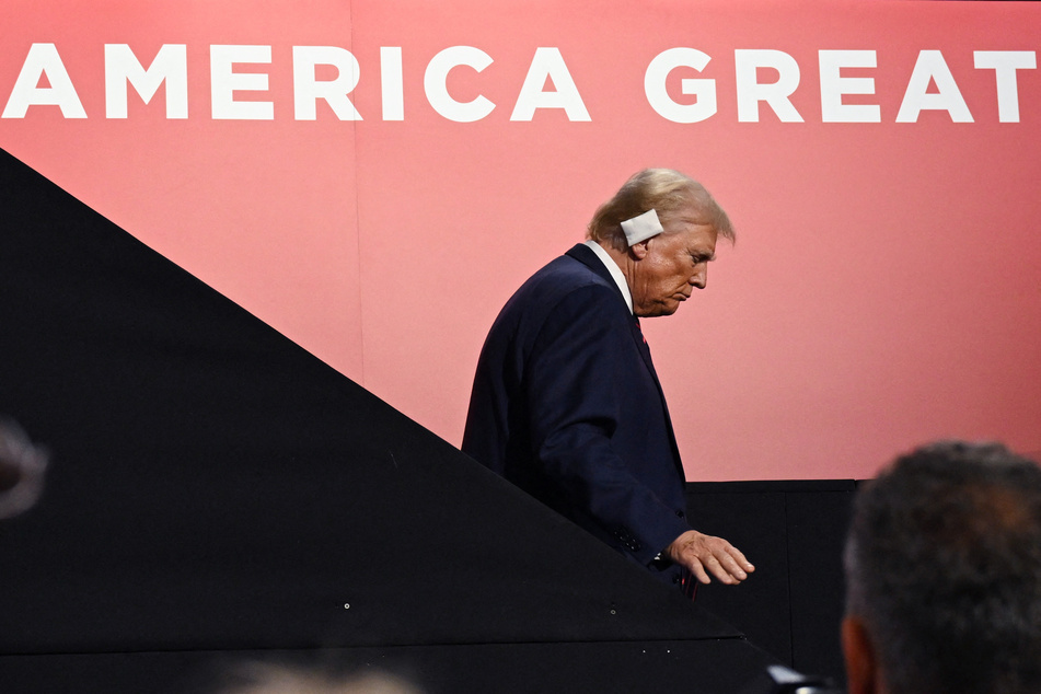 Donald Trump walks down the stairs on Day 3 of the 2024 Republican National Convention.