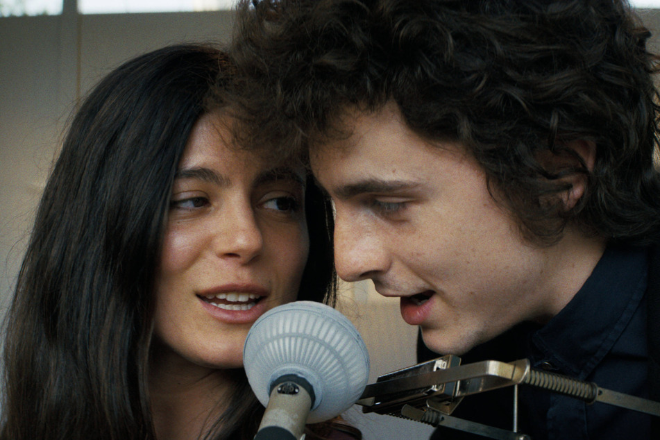 Timothée Chalamet (r.) leads A Complete Unknown, a biopic about music icon Bob Dylan's transition to electric instruments.