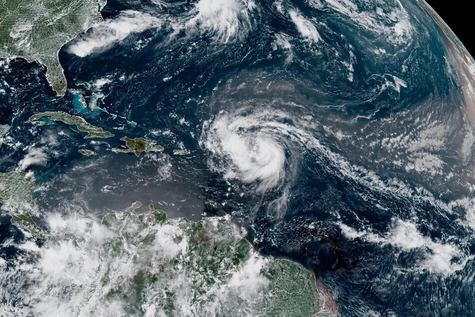 This satellite image provided by the National Oceanic and Atmospheric Administration (NOAA) shows Hurricane Erin forming in the Atlantic Ocean on Friday.