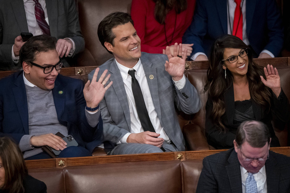 (From l. to r.) George Santos speaking with fellow representatives Matt Gaetz and Lauren Boebert.