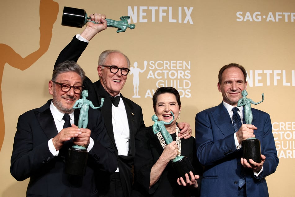 John Lithgow, Ralph Fiennes, Sergio Castellitto, and Isabella Rossellini pose with the award for Outstanding Performance by a Cast in a Motion Picture for Conclave at the 31st Screen Actors Guild Awards.