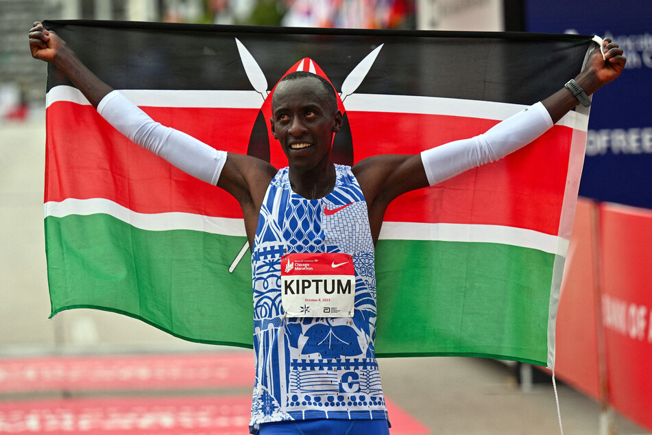 Kelvin Kiptum of Kenya celebrates after setting a new world record time of 2:00:35 at the 2023 Chicago Marathon.