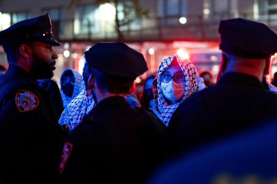 Palestine solidarity protesters are detained by NYPD officers after taking part in a demonstration at Butler Library on the Columbia University campus in New York on May 7, 2025.