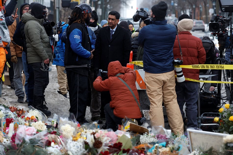Representative Ro Khanna interacts with community members while visiting a memorial for Alex Pretti in Minneapolis, Minnesota, on January 26, 2026.