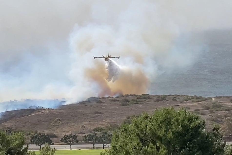 The Mountain Fire continues to burn in large areas of Southern California, with thousands of communities near LA urged to evacuate.