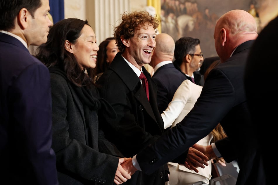 Meta and Facebook CEO Mark Zuckerberg (c.) and his wife Priscilla Chan (center l.) arrive at the inauguration of President-elect Trump.