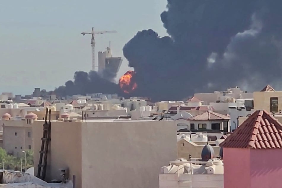 Smoke and flames erupt over the town of Mangaf, south of Kuwait City, after Iran launched retaliatory strikes against its Gulf neighbors.
