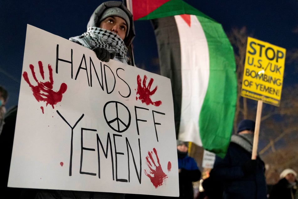 People protest the US and UK strikes across Yemen at a rally in Seattle, Washington.