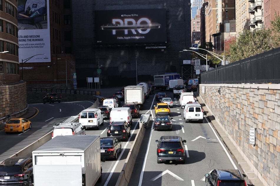 Cars and trucks are seen leaving the Queens Midtown Tunnel on November 14, 2024 in New York City.