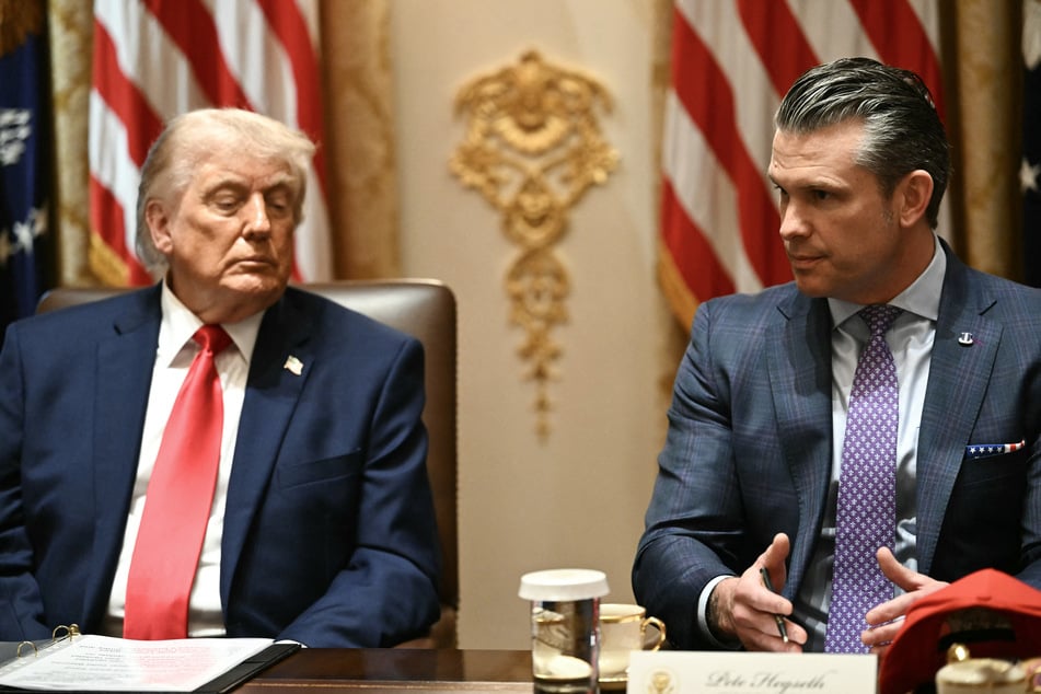 President Donald Trump listens to Defense Secretary Pete Hegseth speak during a Cabinet meeting at the White House on May 27, 2026.