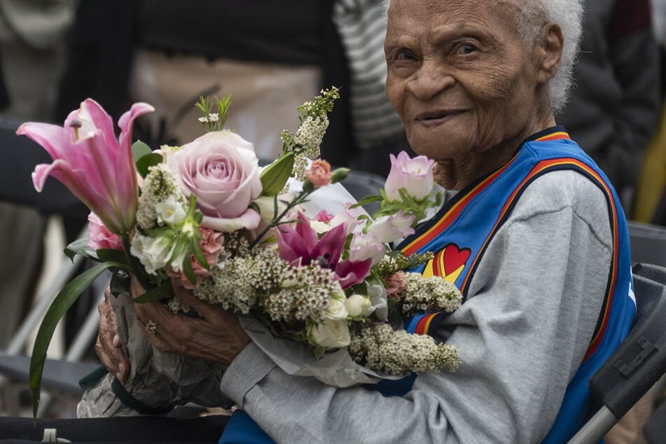 Viola Fletcher receives flowers during a ceremony honoring the victims and survivors of the 1921 Tulsa Massacre on May 31, 2021.