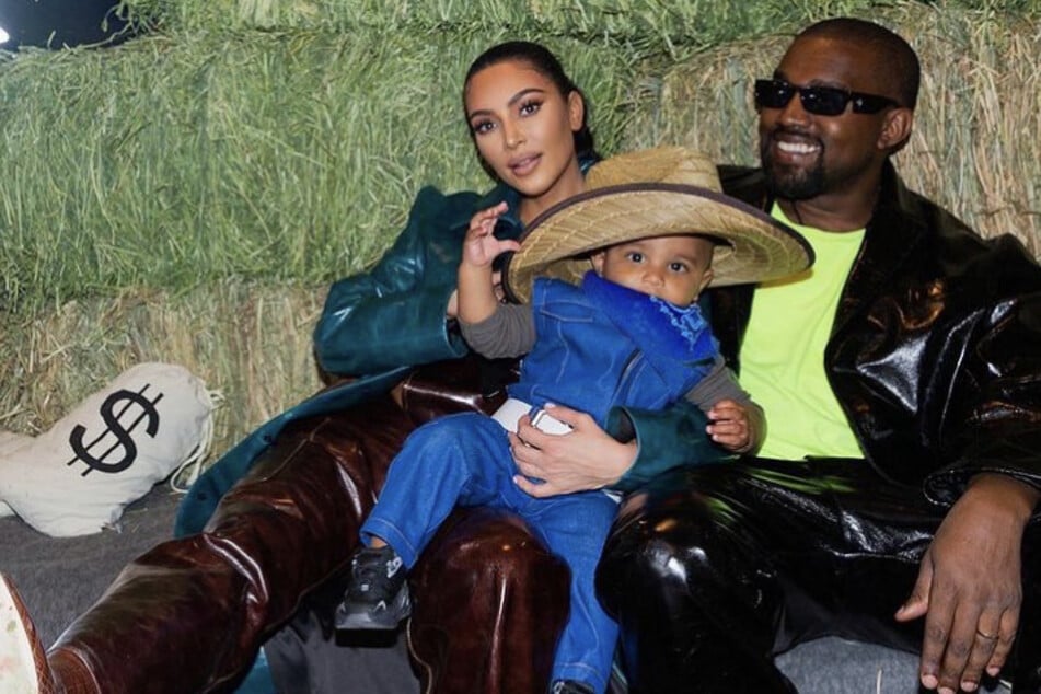 Kim Kardashian with Kanye West and their son Psalm (m) at Kanye's ranch in Wyoming for their daughter North's birthday party,