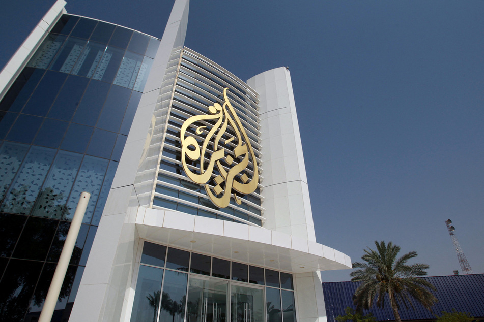 The Al Jazeera Media Network logo is displayed on its headquarters building in Doha, Qatar.