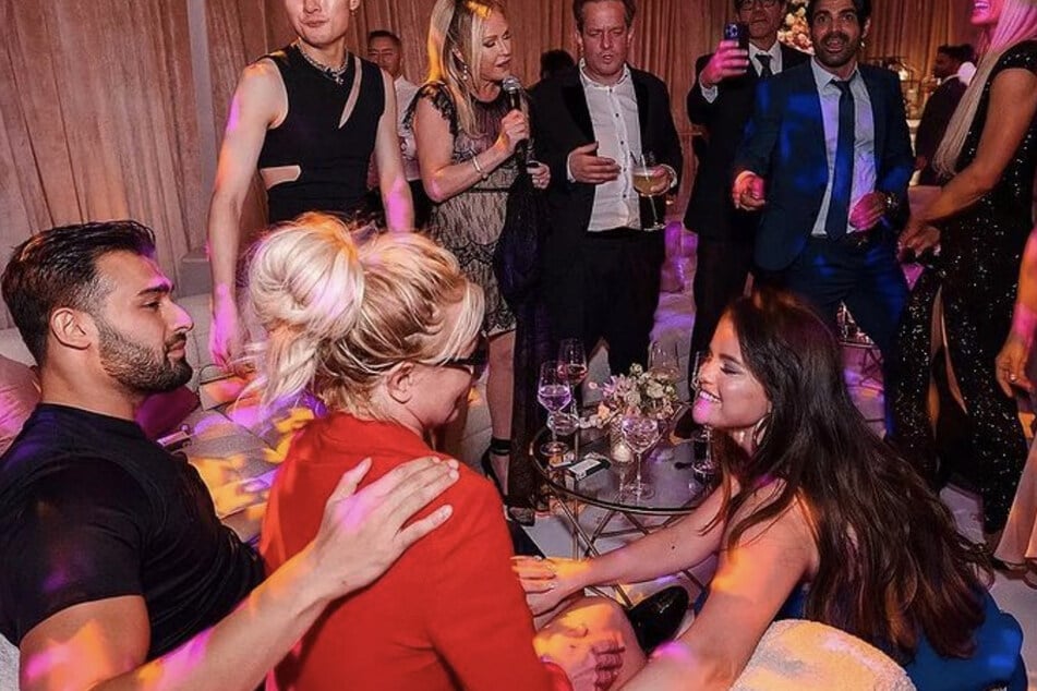 While Britney Spears' immediate family members weren't in attendance at her wedding to Sam Asghari, she was surrounded by her closest friends, including Selena Gomez (r).