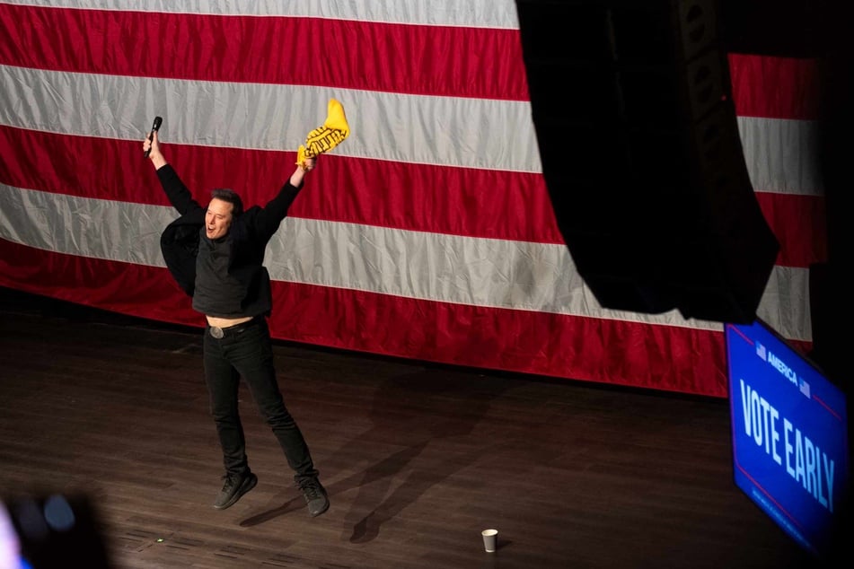 SpaceX and Tesla founder Elon Musk speaks at a town hall with Republican candidate U.S. Senate Dave McCormick at the Roxain Theater on Sunday in Pittsburgh, Pennsylvania. Musk also awarded an attendee $1 million dollars during the event.