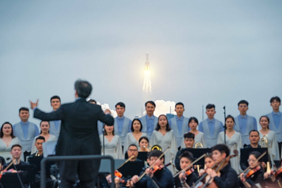 Members of Xi an Symphony Orchestra performed on the beach at the launch.