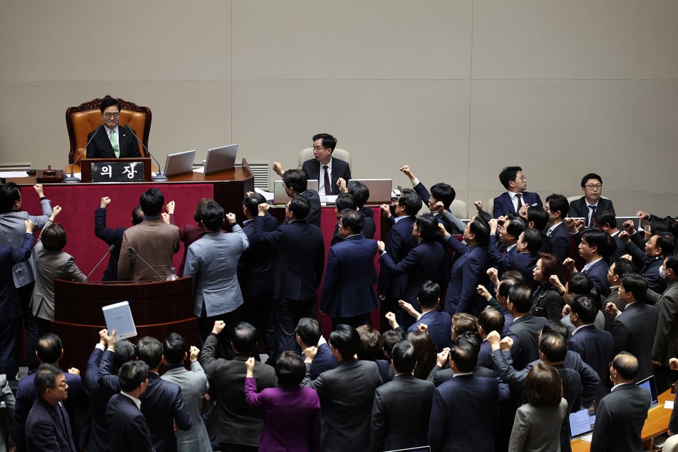 South Korean lawmakers voted to impeach acting president Han Duck-soo amid chaotic scenes on Friday.