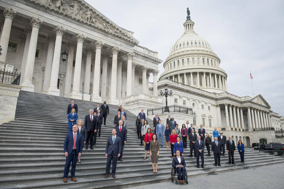 Newly sworn-in GOP members of Congress – including Mary Miller – pose for a group photograph on the East Front Steps of the US Capitol, just two days before it was stormed.