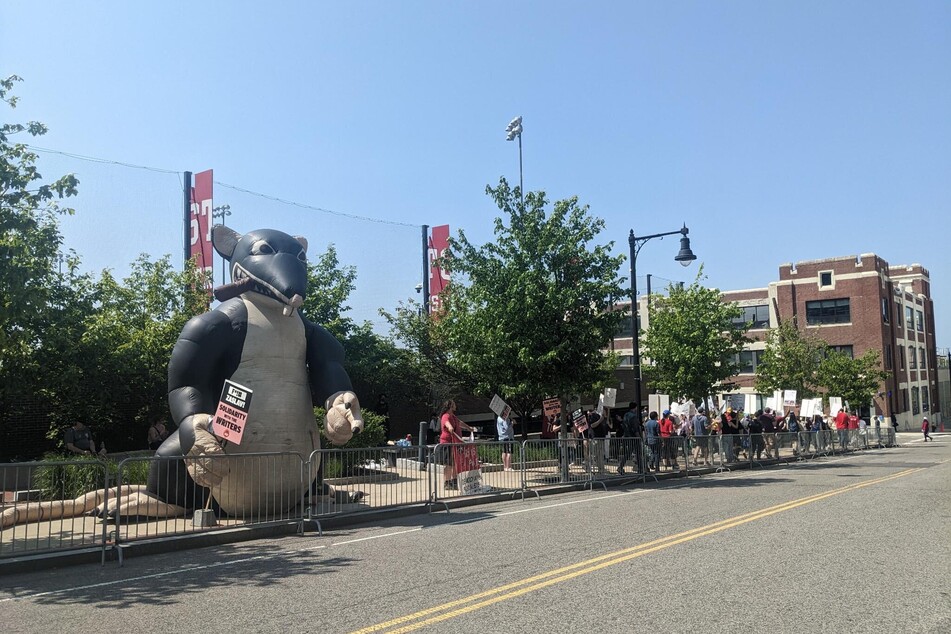 Scabby the Rat joins the picket line to protest David Zaslav's Boston University appearance.