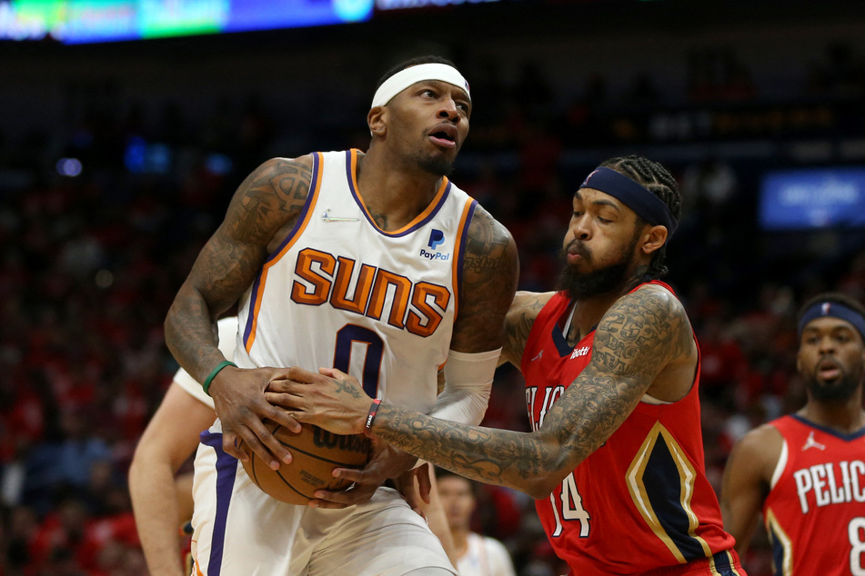 Phoenix Suns forward Torrey Craig (l.) was defended by New Orleans Pelicans forward Brandon Ingram in the second half of game three of the first round for the 2022 NBA Playoffs at the Smoothie King Center. The Suns won 114-111. (Chuck Cook-USA TODAY Sports)