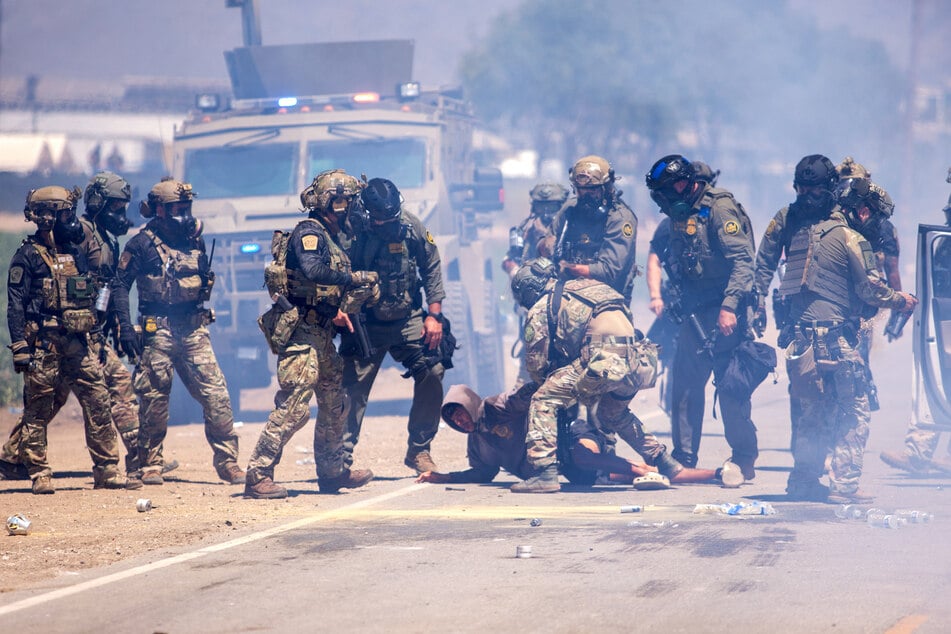 Raids on agricultural sites Thursday resulted in the arrests of 200 undocumented migrants and clashes between law enforcement officials and protesters.