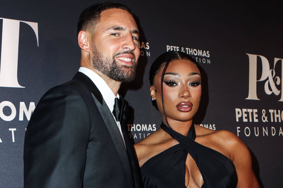 Megan Thee Stallion and Klay Thompson (l.) documented their intense workout in a cute gym video.