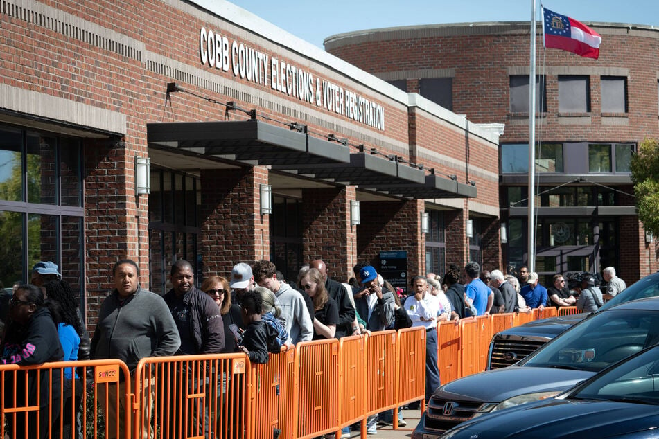 Early voting in Georgia got underway Tuesday, with a record-breaking 300,000-plus votes cast.