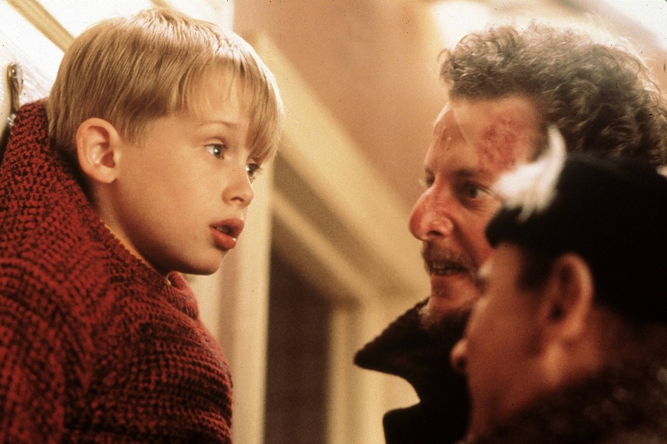 Kevin McCallister, played by Macaulay Culkin (l), gets left home alone to deal with two relentless, yet clueless burglars in the holiday classic, Home Alone.